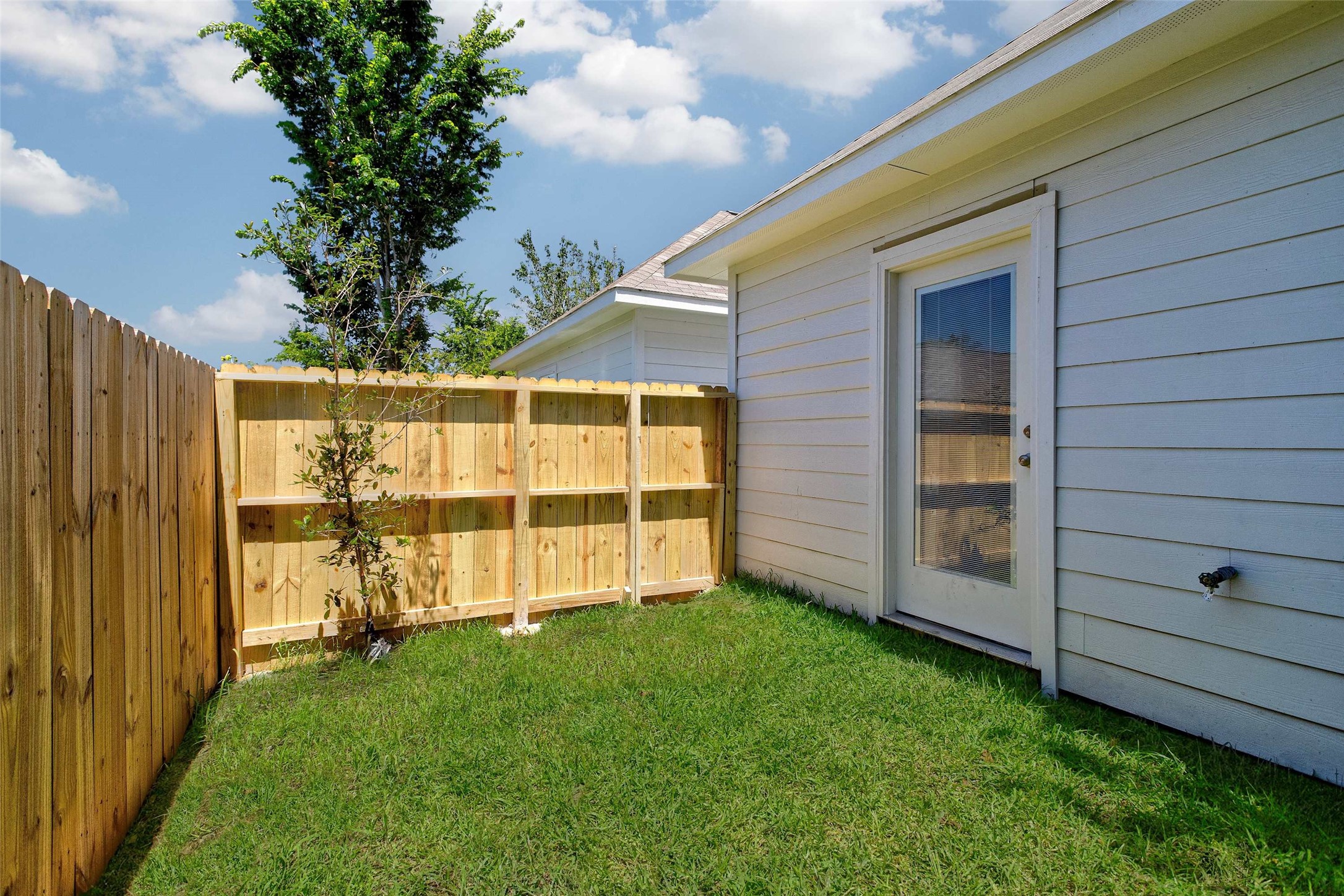 9816 Masterson Street Houston, TX 77029 - Photo 23 of 23 a view of a backyard with wooden fence