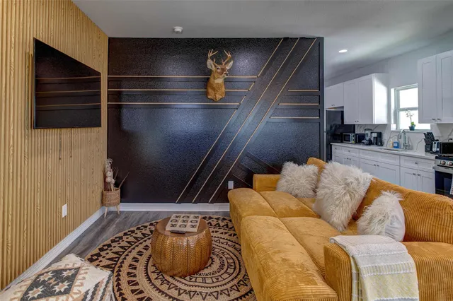 a living room with furniture and a rug