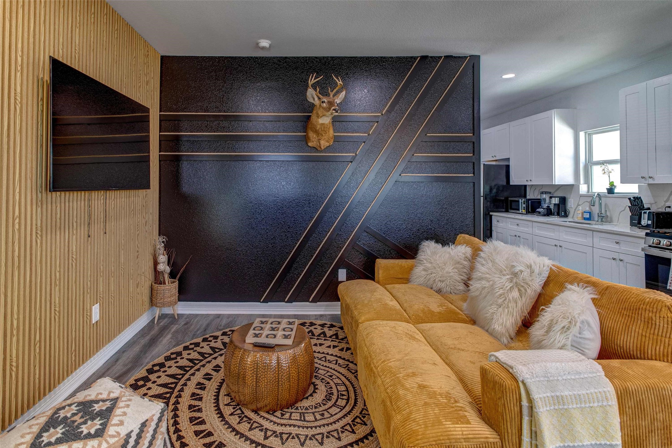 9816 Masterson Street Houston, TX 77029 - Photo 4 of 23 a living room with furniture and a rug