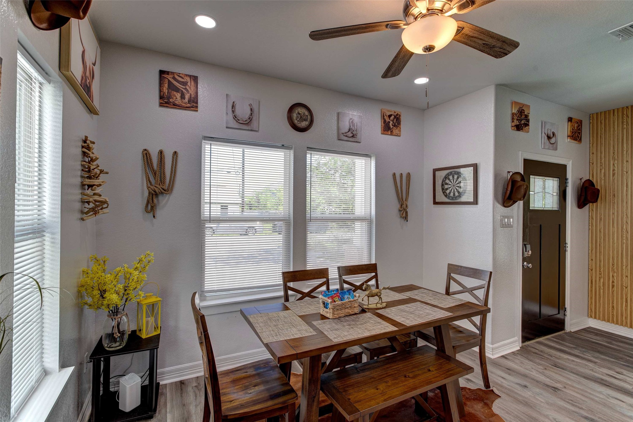 9816 Masterson Street Houston, TX 77029 - Photo 8 of 23 a view of a dining room with furniture window and wooden floor