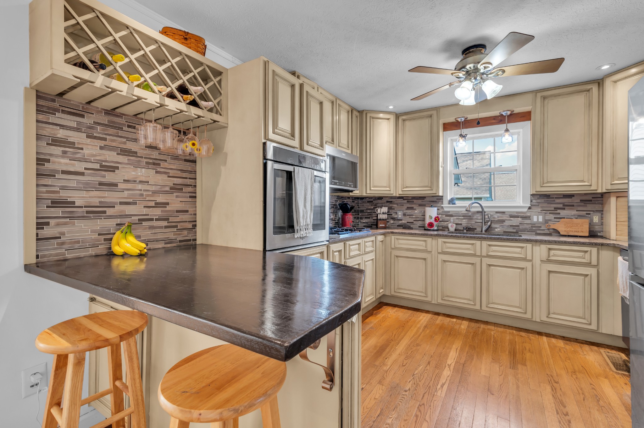 672 Old Snow Hill Road Dowelltown, TN 37059 - Photo 12 of 54 a kitchen with stainless steel appliances granite countertop a stove a sink and a microwave