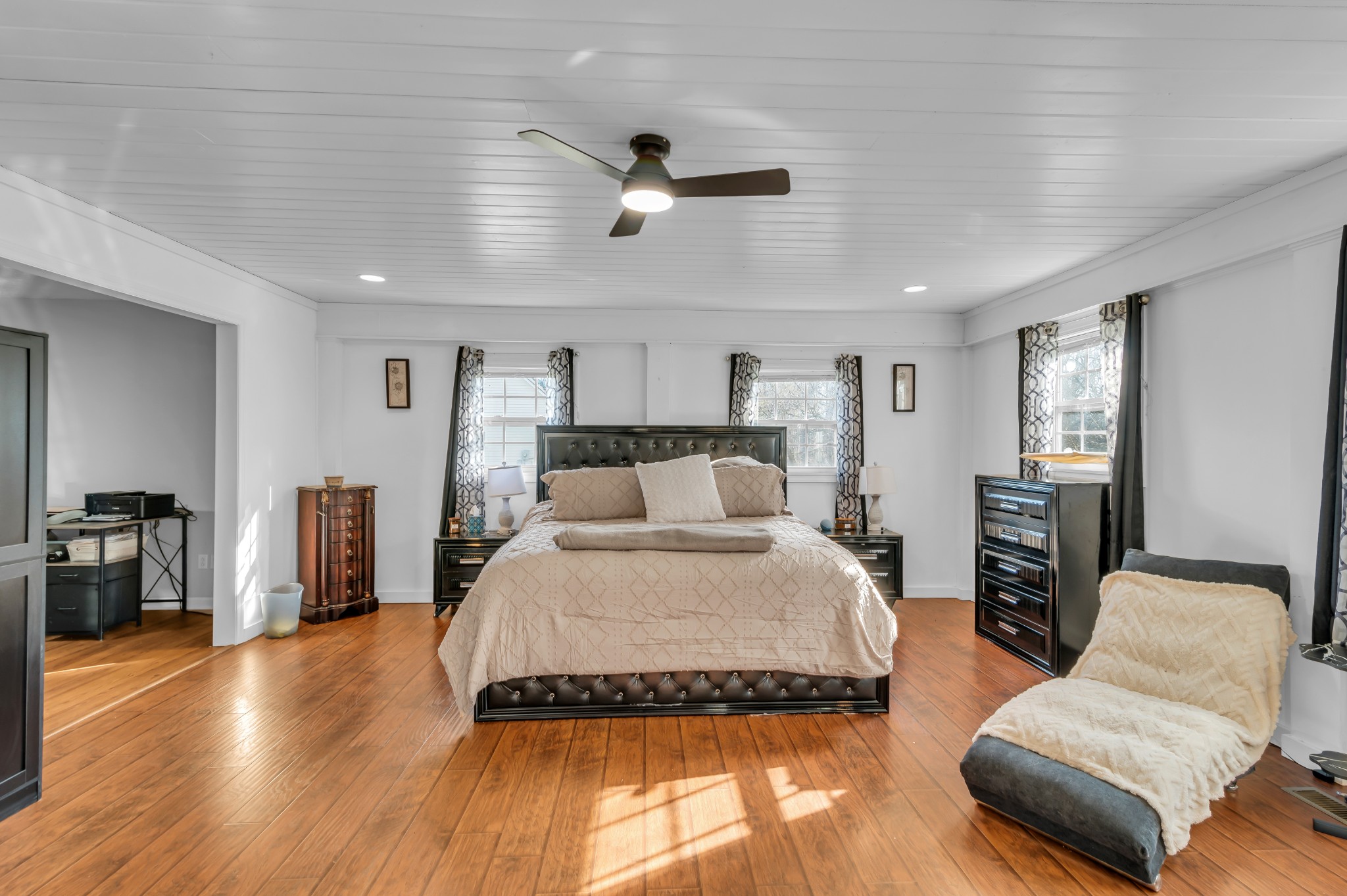 672 Old Snow Hill Road Dowelltown, TN 37059 - Photo 24 of 54 a spacious bedroom with a bed and wooden floor