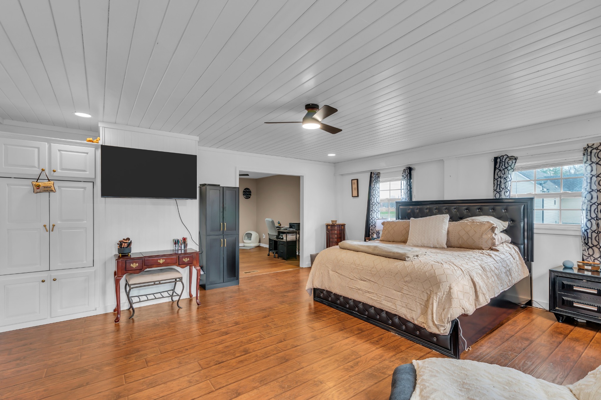 672 Old Snow Hill Road Dowelltown, TN 37059 - Photo 25 of 54 a bedroom with a bed and a flat screen tv