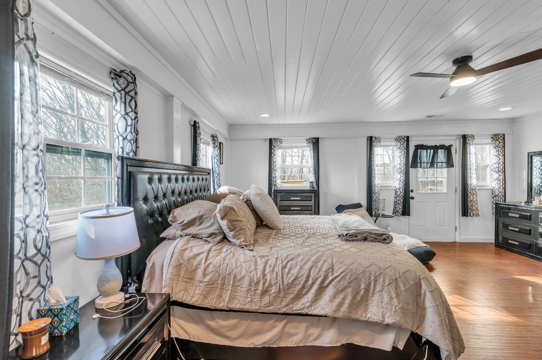 672 Old Snow Hill Road Dowelltown, TN 37059 - Photo 26 of 54 a bed sitting in a spacious bedroom next to a window