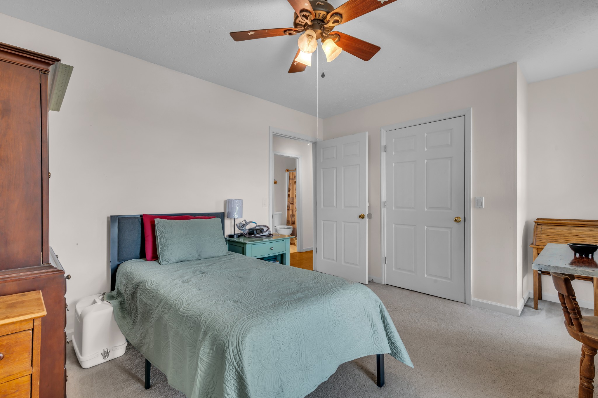 672 Old Snow Hill Road Dowelltown, TN 37059 - Photo 31 of 54 a bedroom with a bed and a chandelier