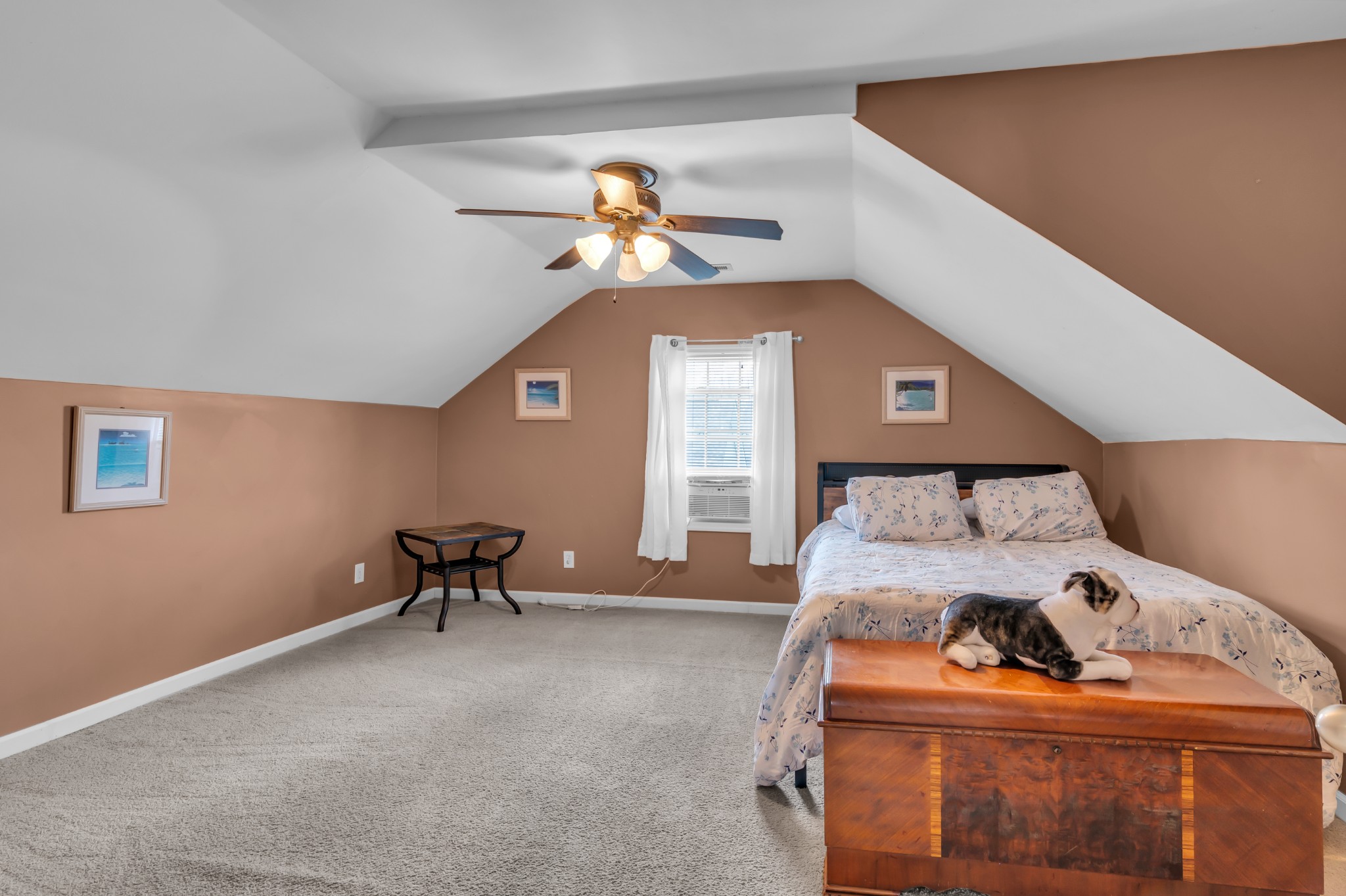 672 Old Snow Hill Road Dowelltown, TN 37059 - Photo 39 of 54 a bedroom with a bed and a chandelier