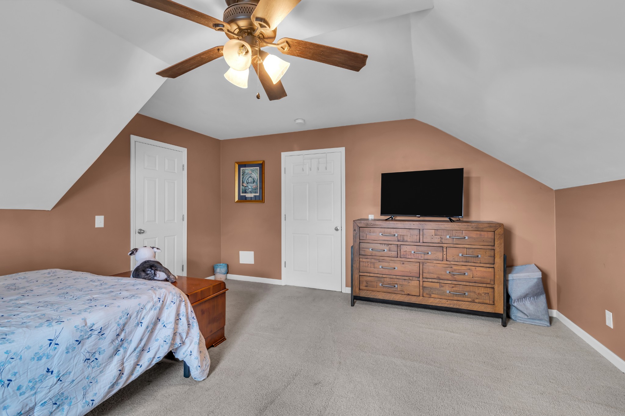 672 Old Snow Hill Road Dowelltown, TN 37059 - Photo 40 of 54 a bedroom with a bed and a flat screen tv