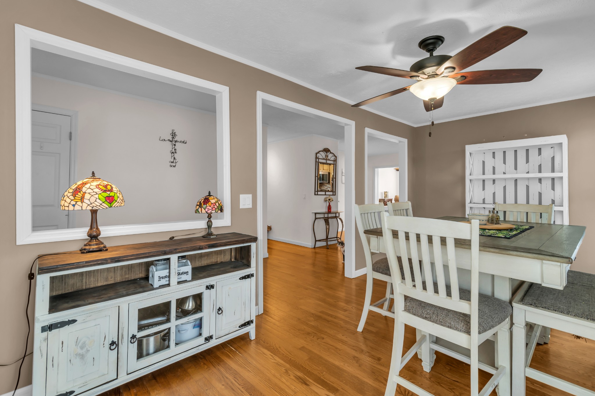 672 Old Snow Hill Road Dowelltown, TN 37059 - Photo 9 of 54 a kitchen with stainless steel appliances a stove a chandelier and a dining table