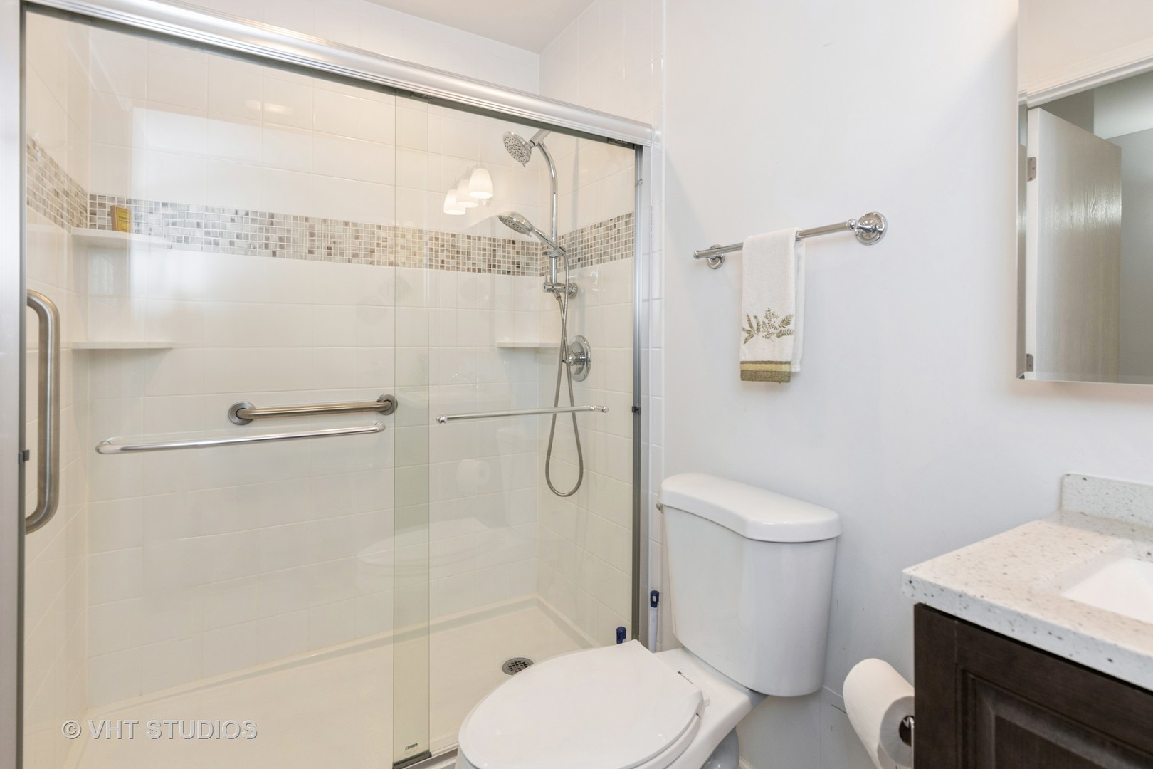 800 Ridge Road, Unit 108 Wilmette, IL 60091 - Photo 8 of 16 a bathroom with a toilet a sink and shower