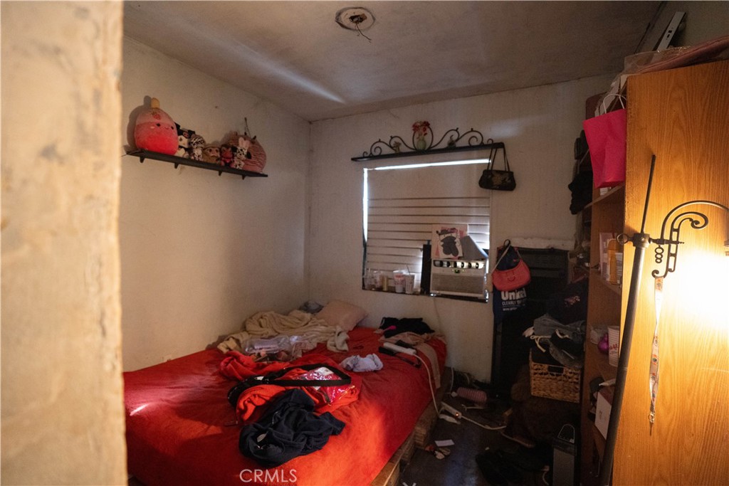 6174 Jurupa Avenue Riverside, CA 92504 - Photo 24 of 30 a bed room with a bed and a window