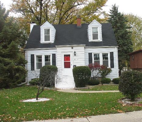 18412 Riegel Road Homewood, IL 60430 - Photo 1 of 1 a front view of a house with a yard and green space