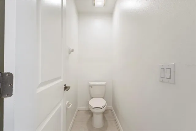 a white toilet sitting next to a white sink