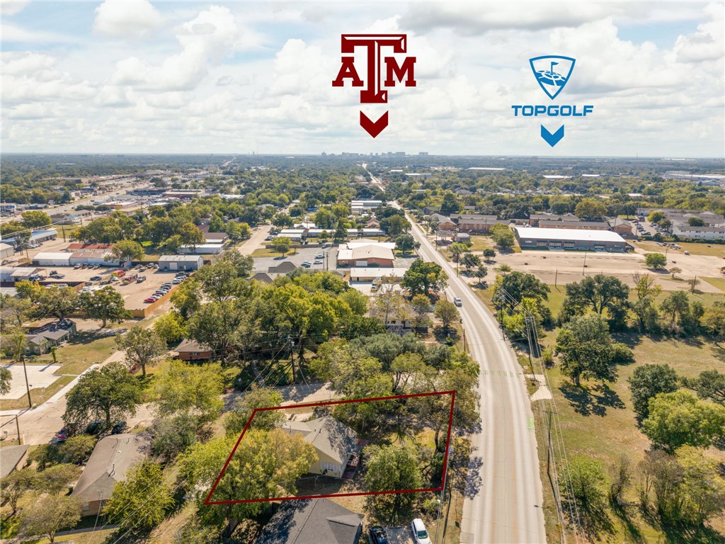Aerial view of property and surrounding area featuring property boundaries highlighted