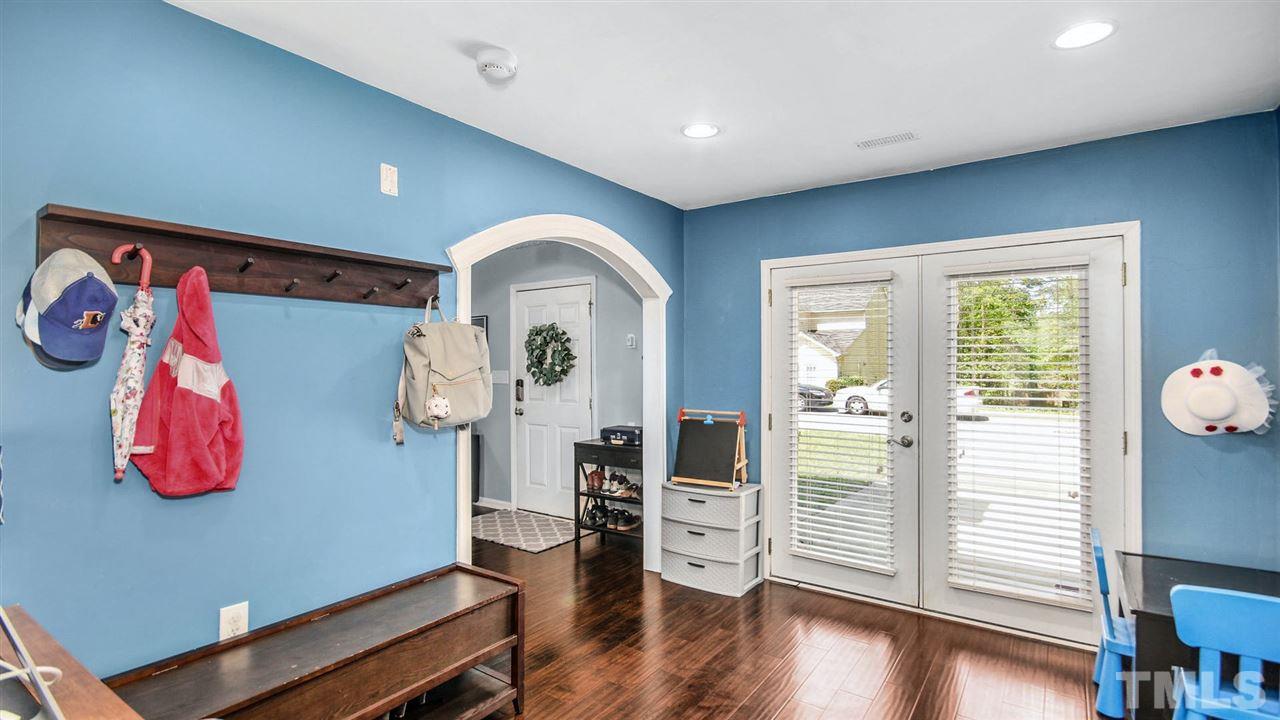 5720 Forest Point Road Raleigh, NC 27610 - Photo 12 of 22 a view of a livingroom with wooden floor and furniture