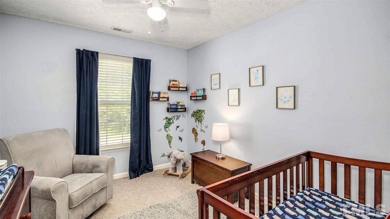 5720 Forest Point Road Raleigh, NC 27610 - Photo 17 of 22 a bedroom with furniture and a window