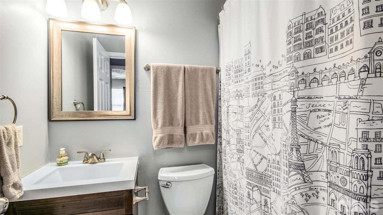 5720 Forest Point Road Raleigh, NC 27610 - Photo 18 of 22 a bathroom with a sink toilet and shower