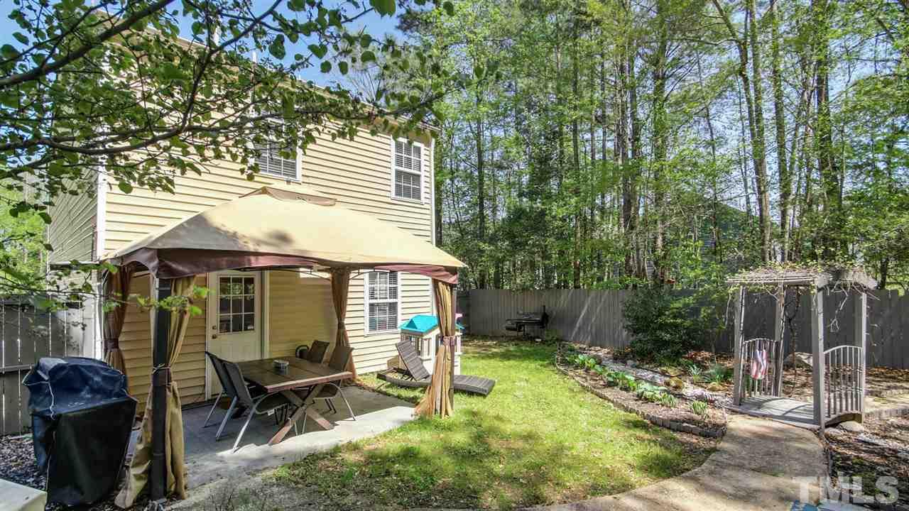 5720 Forest Point Road Raleigh, NC 27610 - Photo 19 of 22 a balcony with table and chairs and potted plants