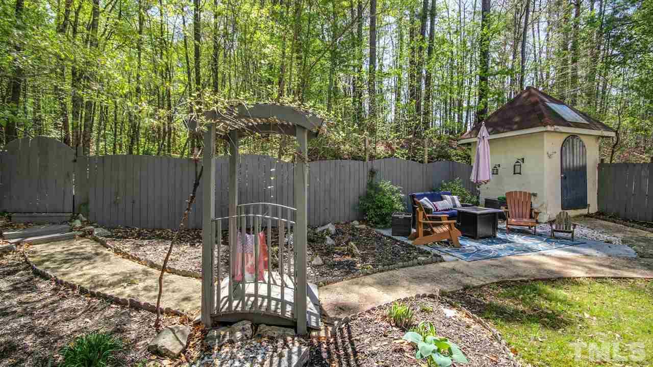 5720 Forest Point Road Raleigh, NC 27610 - Photo 20 of 22 a view of a patio with table and chairs and potted plants