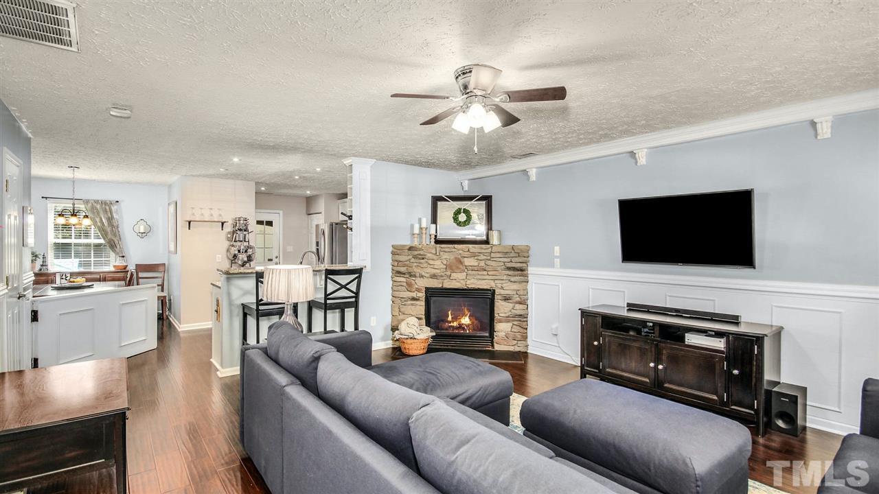 5720 Forest Point Road Raleigh, NC 27610 - Photo 3 of 22 a living room with furniture fireplace and flat screen tv