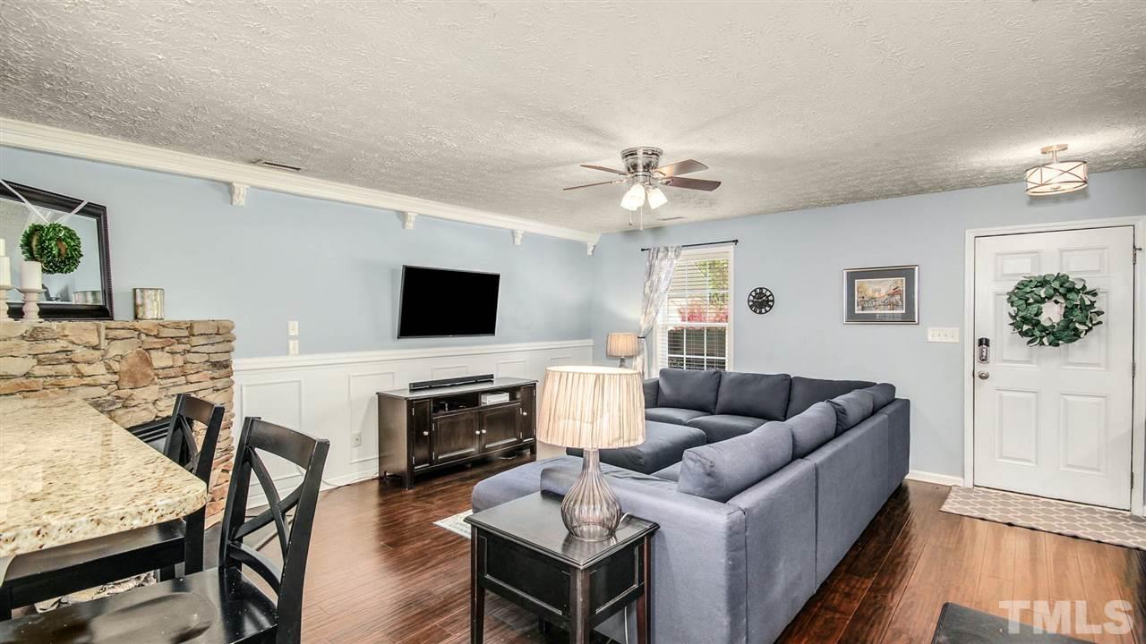 5720 Forest Point Road Raleigh, NC 27610 - Photo 5 of 22 a living room with furniture and a flat screen tv