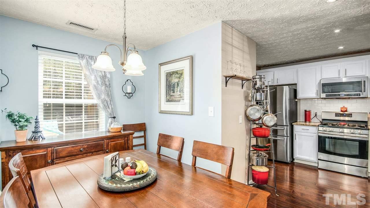 5720 Forest Point Road Raleigh, NC 27610 - Photo 7 of 22 a room with furniture and a chandelier