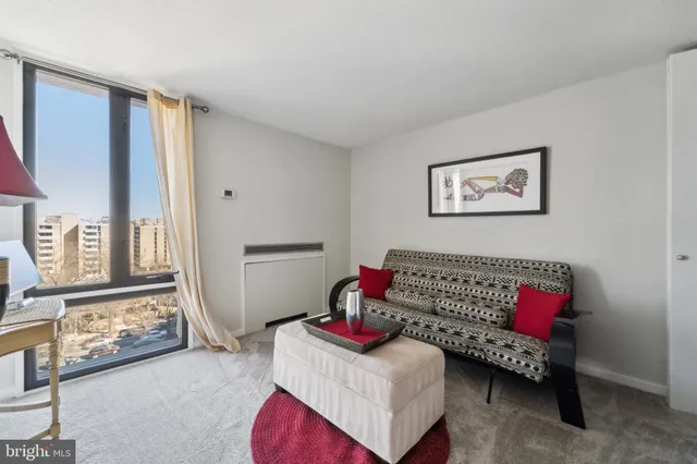 a bedroom with a large bed and a couch