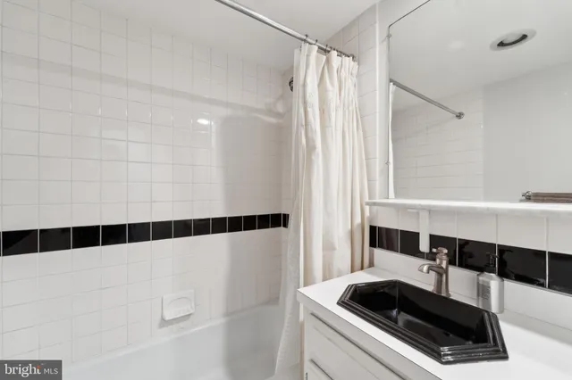a view of a utility room with cars and a sink