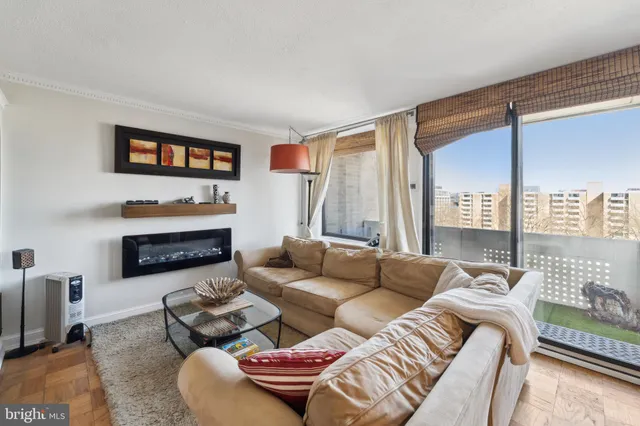 a living room with furniture and a large window