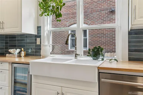 a bathroom with a sink and a potted plant