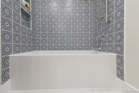 a view of a bathtub in a bathroom