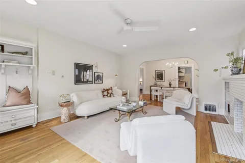 a living room with furniture and a lamp