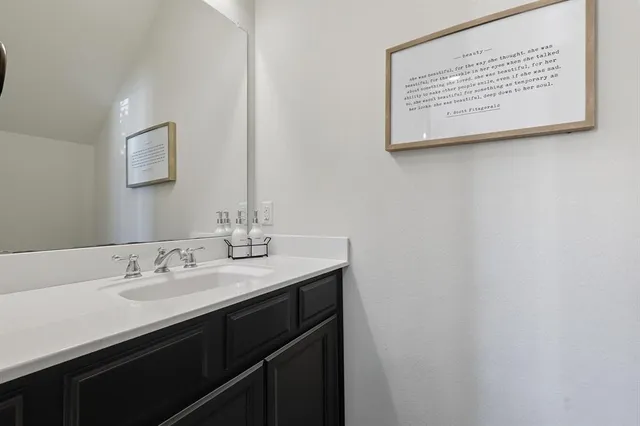 a bedroom with bed and a flat screen tv