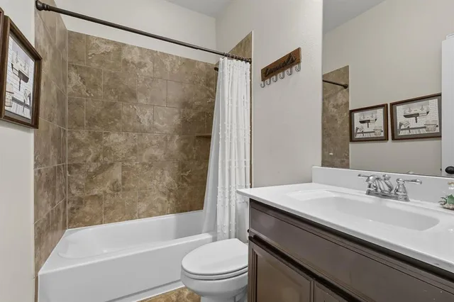 a bedroom with a bed and a night stand