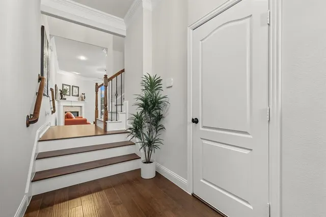 a view of entryway and hall with wooden floor