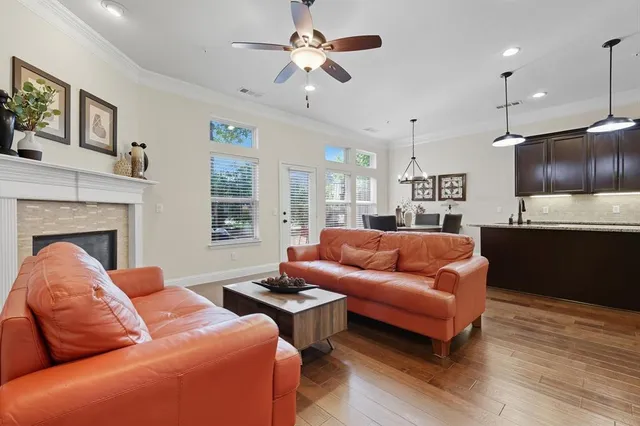 a dining room with furniture window and wooden floor