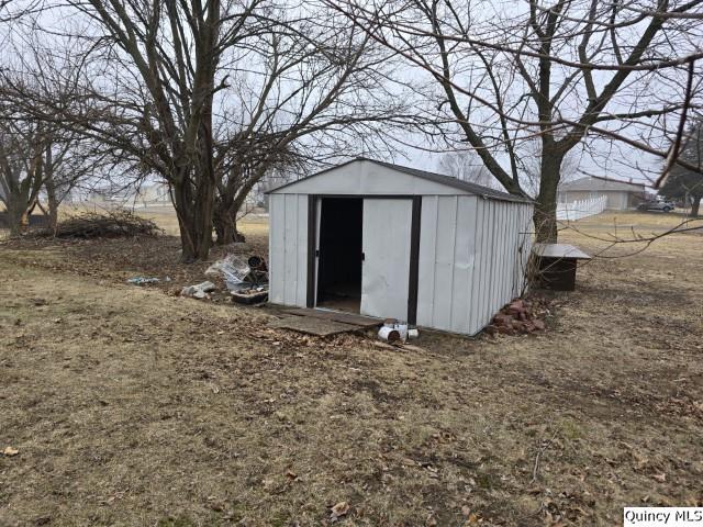 219 South 1st Street Carthage, IL 62321 - Photo 21 of 23 a view of a wooden house with a large tree