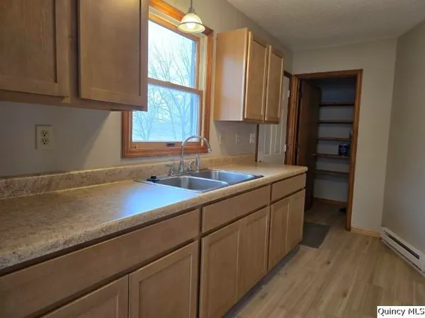 a kitchen with a sink and cabinets