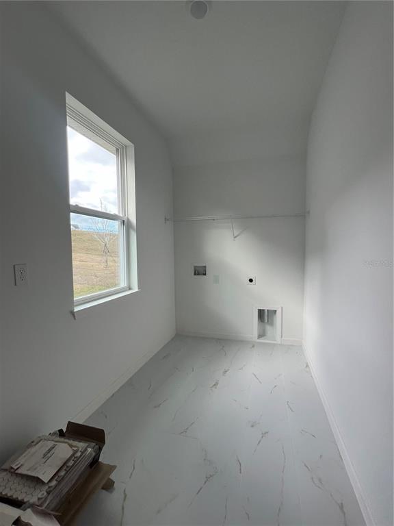 2075 Keystone Pass Boulevard Minneola, FL 34715 - Photo 12 of 27 an empty room with windows and closet