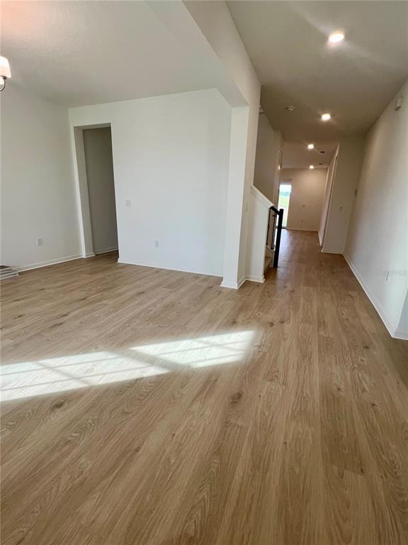 2075 Keystone Pass Boulevard Minneola, FL 34715 - Photo 2 of 27 a view of a hallway with wooden floor