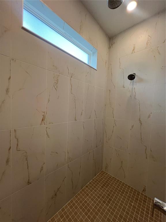 2075 Keystone Pass Boulevard Minneola, FL 34715 - Photo 22 of 27 a bathroom with a shower