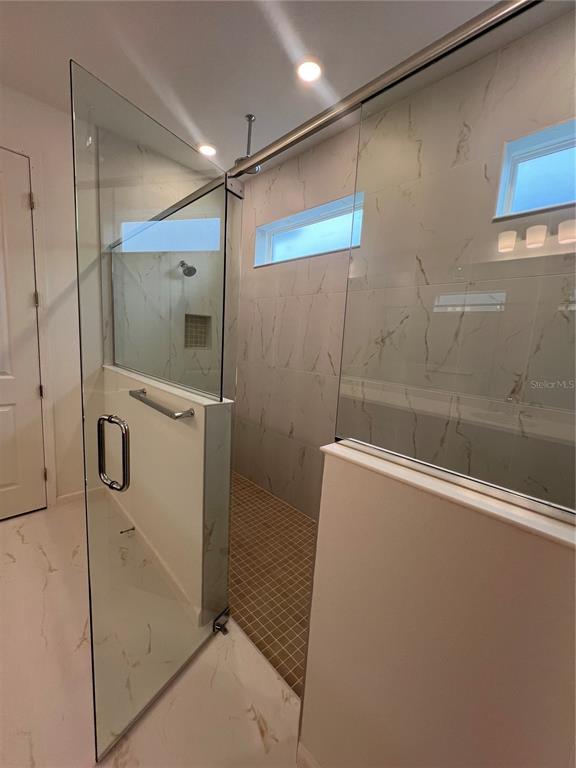 2075 Keystone Pass Boulevard Minneola, FL 34715 - Photo 24 of 27 a bathroom with a shower and a shower