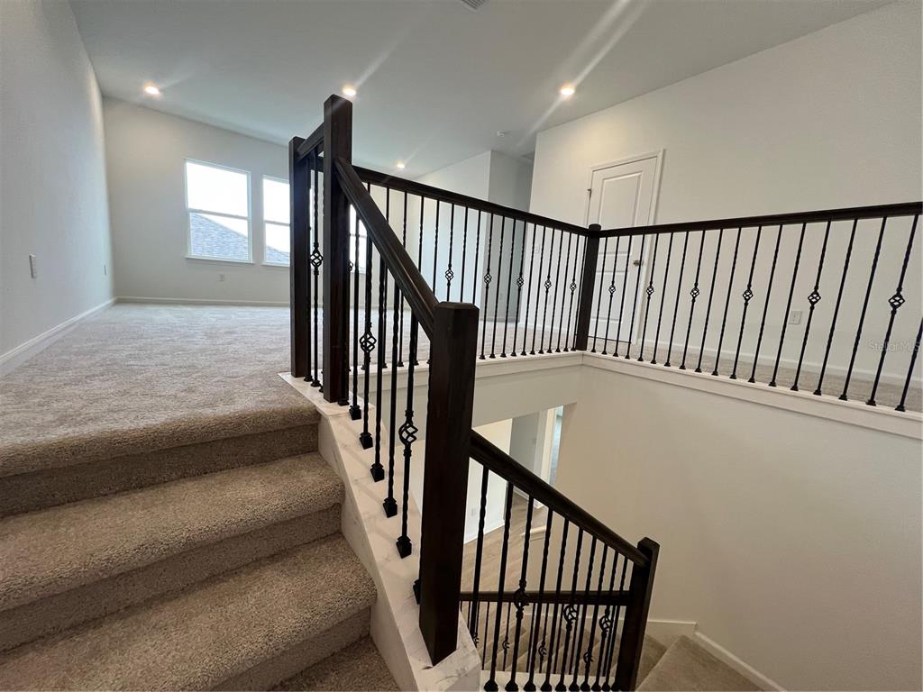 2075 Keystone Pass Boulevard Minneola, FL 34715 - Photo 25 of 27 a view of hallway with stairs