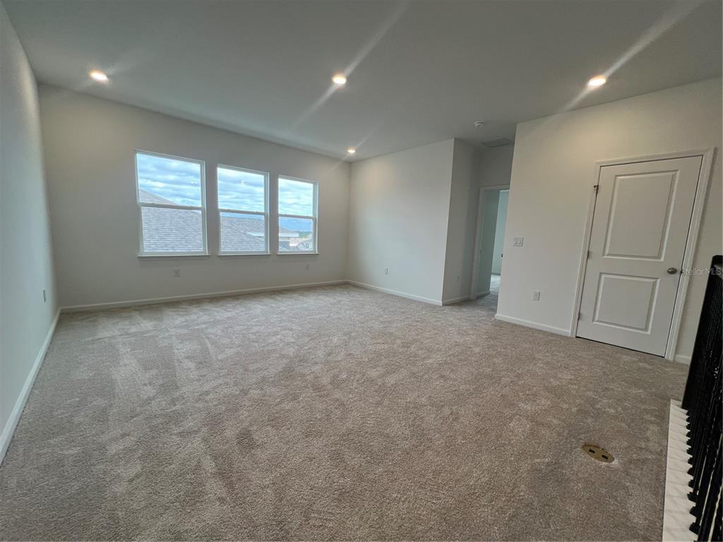 2075 Keystone Pass Boulevard Minneola, FL 34715 - Photo 26 of 27 an empty room with windows