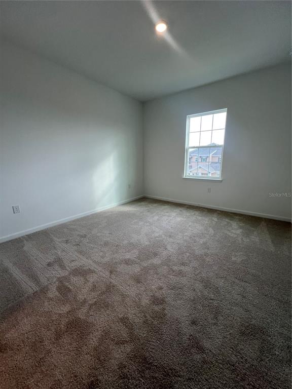 2075 Keystone Pass Boulevard Minneola, FL 34715 - Photo 27 of 27 an empty room with windows