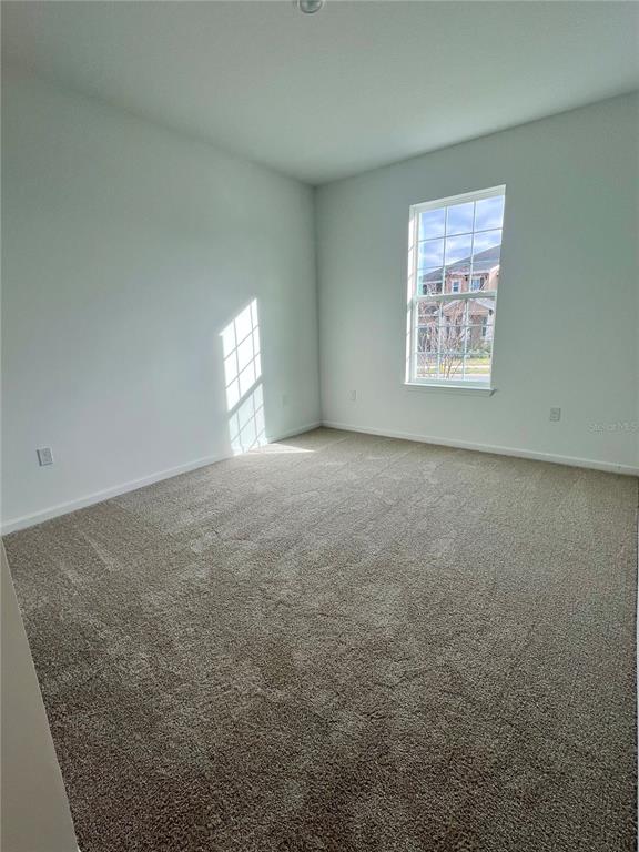 2075 Keystone Pass Boulevard Minneola, FL 34715 - Photo 3 of 27 an empty room with windows