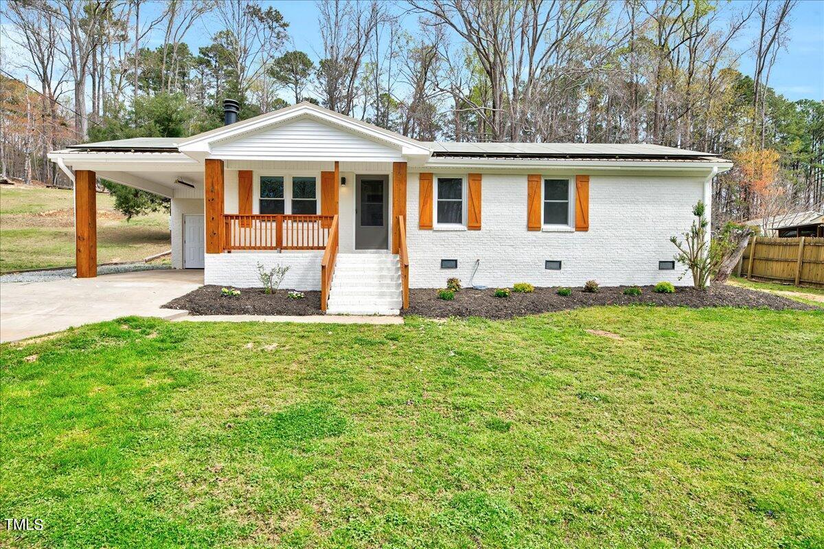 2808 Oak Ridge Court Raleigh, NC 27603 - Photo 1 of 43 a front view of a house with a yard