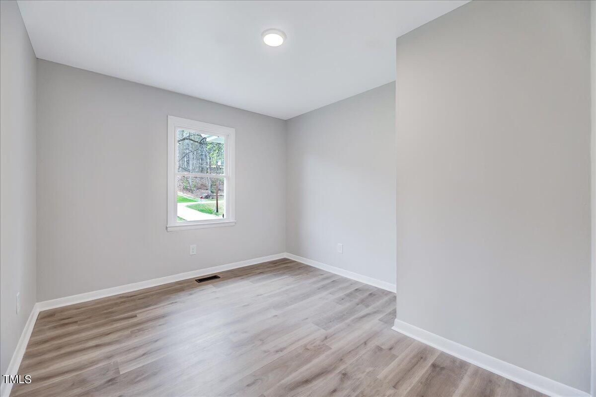 2808 Oak Ridge Court Raleigh, NC 27603 - Photo 29 of 43 an empty room with a window