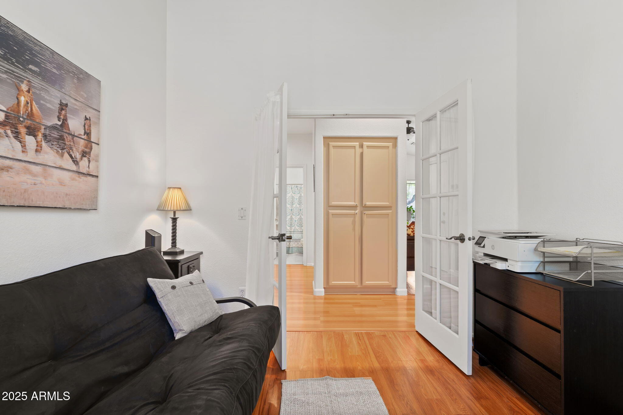 4169 East Hallihan Drive Cave Creek, AZ 85331 - Photo 9 of 13 a living room with stainless steel appliances furniture a rug and a wooden floor