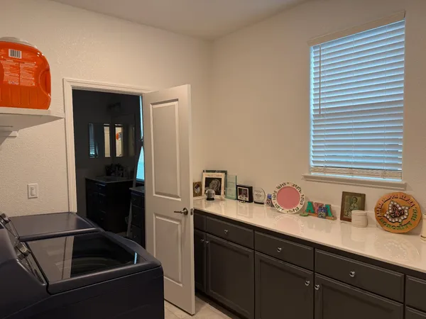 a kitchen with a sink and cabinets