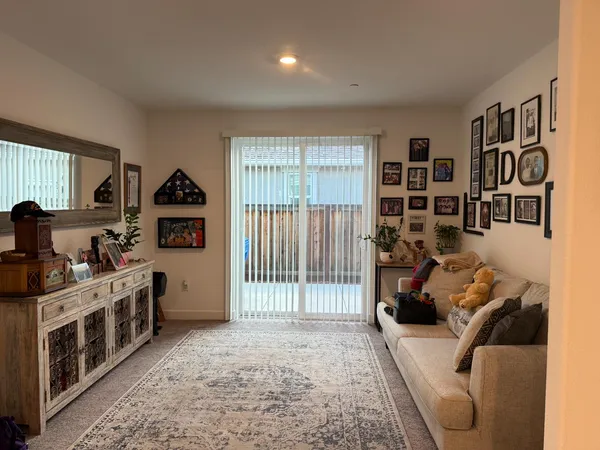 a living room with furniture window and wooden floor